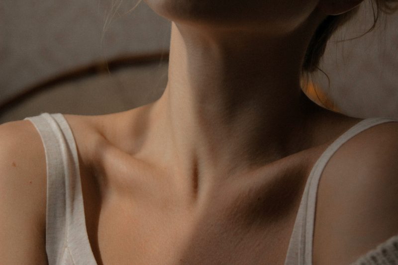 Close-up of woman’s neck showing dry, thinning skin during menopause caused by hormonal changes and reduced estrogen