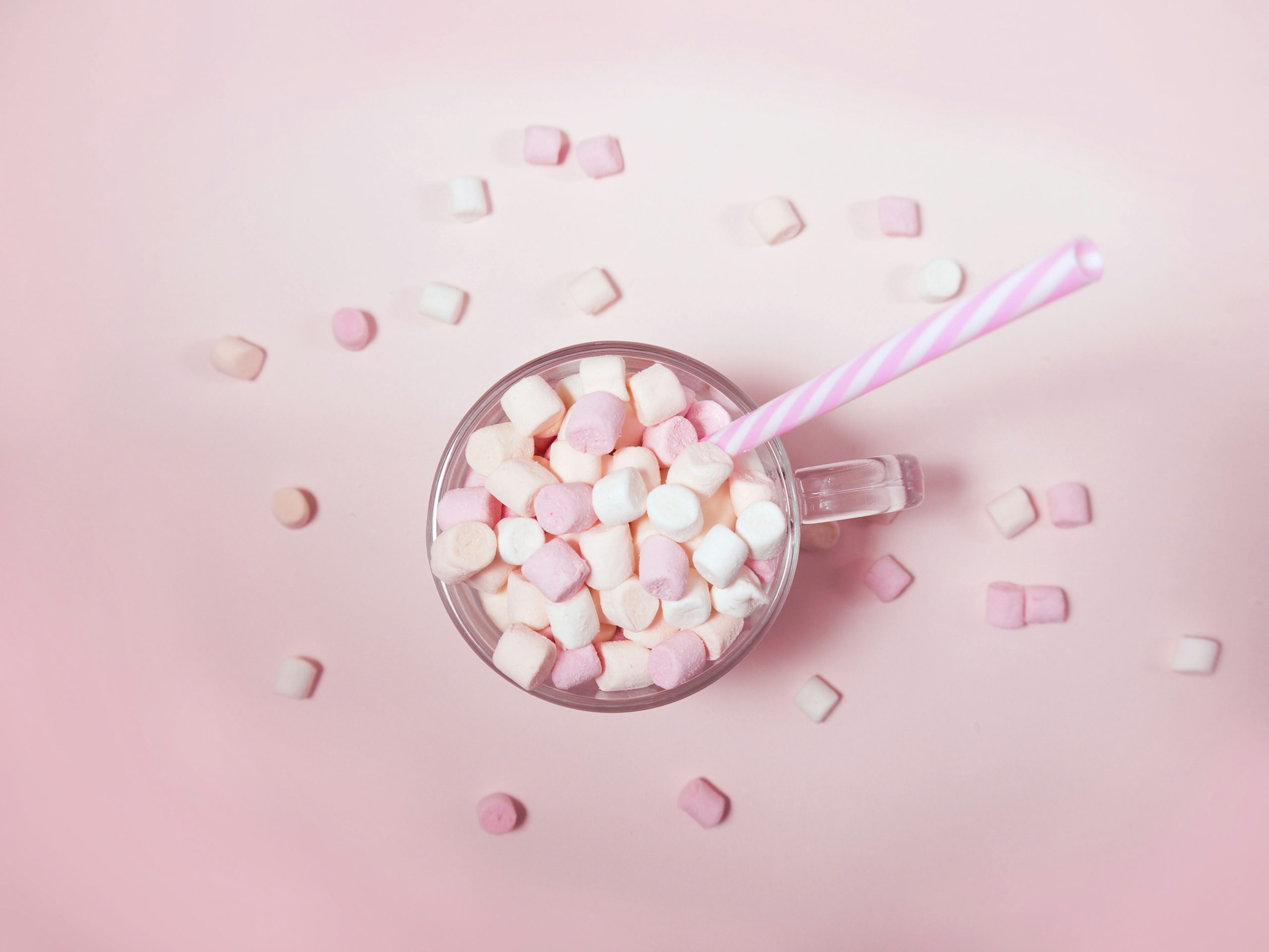 Cup of sugary marshmallows with straw – symbolizing sugar cravings during perimenopause