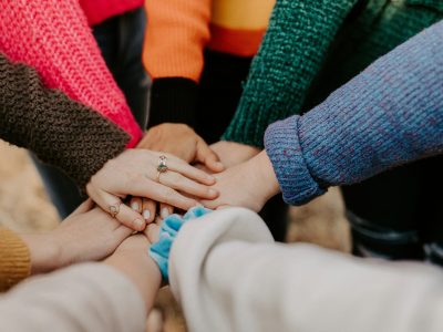 Supportive Hands: Unity in the Menopause Community Hands coming together symbolizing support and connection in the menopause community